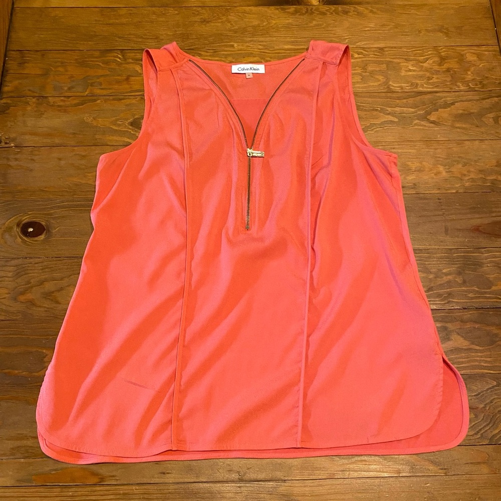 Calvin Klein has salmon colored blouse size medium
